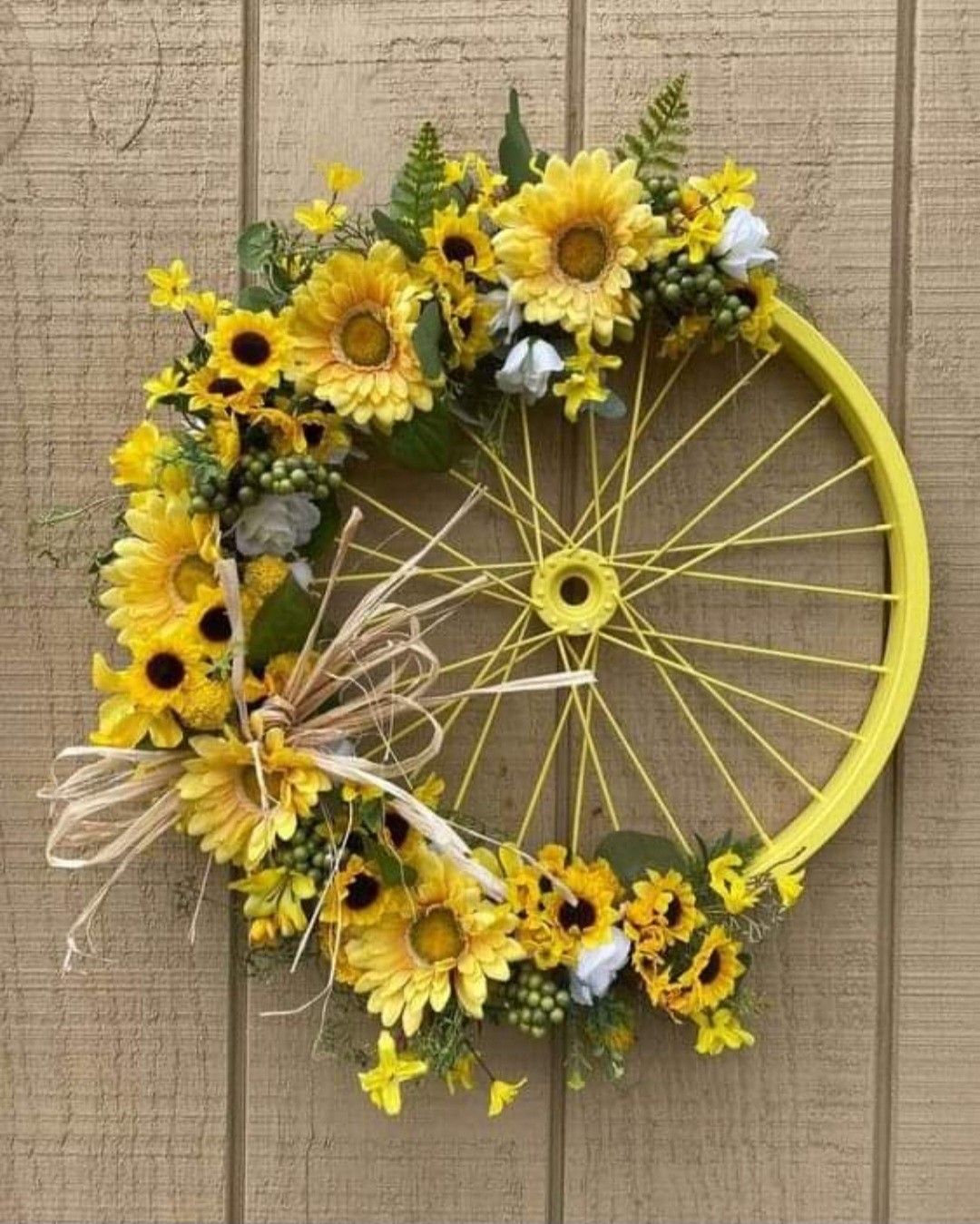 Yellow bike wheel with yellow flowers